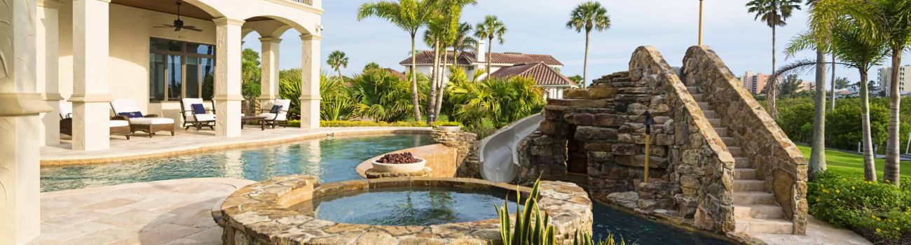Better Living Beautiful view from an estate home overlooking a swimming pool.