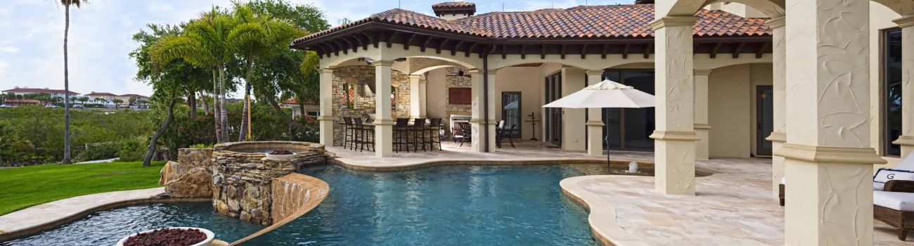 Better Living Beautiful view from an estate home overlooking a swimming pool.