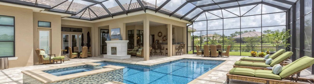 Outdoor Dining and Swimming Pool Outdoor dining room, bar and swimming pool all under a lanai screen.